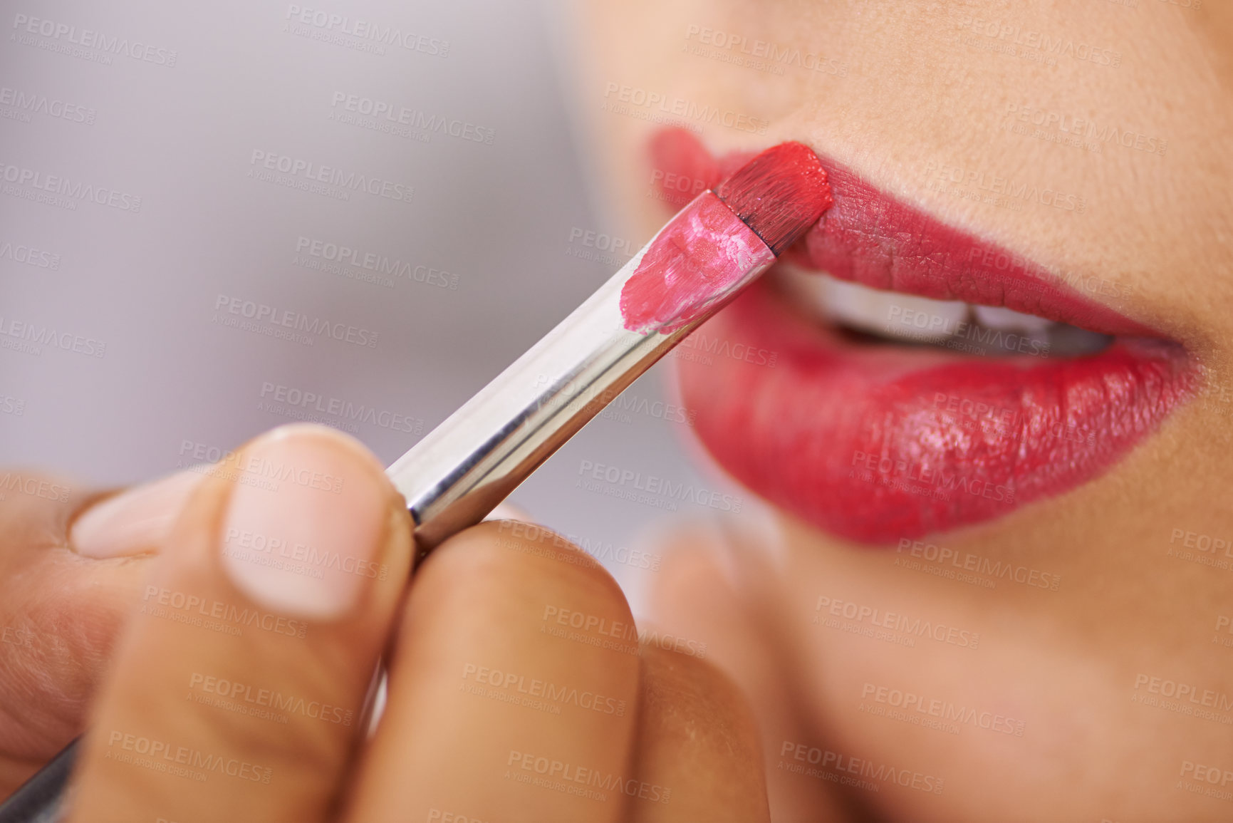 Buy stock photo Closeup, woman and lipstick brush on lips for beauty with hands, application of cosmetics product and glamour. Person, mouth and color makeup for skincare, aesthetic makeover and cosmetology at salon