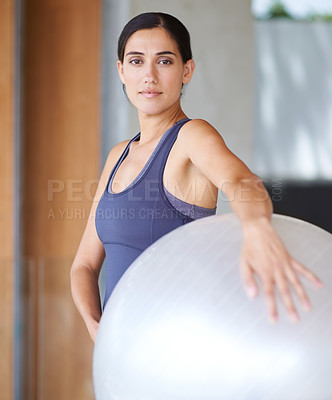 Buy stock photo Woman, portrait and exercise with ball for workout, training or health and wellness at home. Face of active female person or young yogi with gym equipment for pilates, fitness or warm up at the house