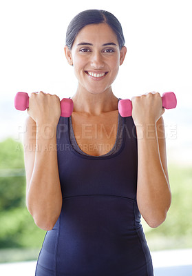 Buy stock photo Portrait of a young woman lifting weights outside