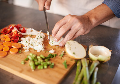 Buy stock photo Chopping board, hands and man with vegetables, closeup and prepare a healthy meal at home. Zoom, male person and chef in a kitchen, vegan diet and nutrition with organic food, dinner and vegetarian