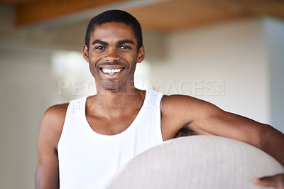 Buy stock photo Portrait, fitness and ball with black man at gym, in tank top for health, wellness or workout. Exercise, training and vitality with happy young person in vest for challenge or performance routine