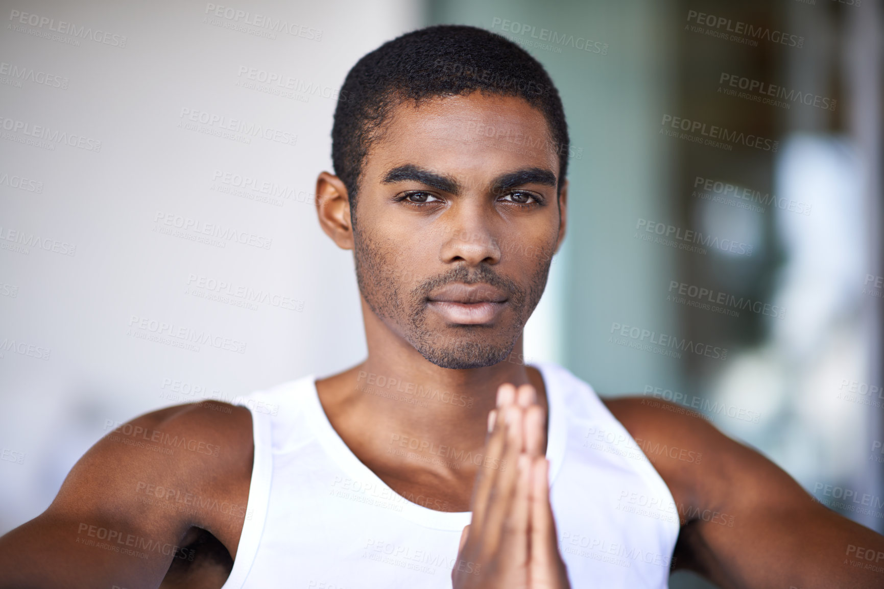 Buy stock photo Black man, portrait and praying hands with faith for religion, hope and grateful mindset at home. African person, serious face and peace with spiritual gesture for mindfulness, worship and praise