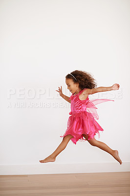 Buy stock photo Cropped shot of an exuberant little girl running indoors