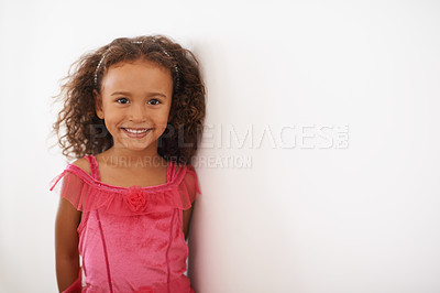 Buy stock photo Portrait of a little girl in a pink dress smiling at the camera