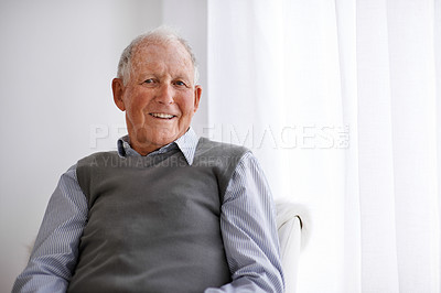 Buy stock photo Portrait of a smiling senior man relaxing in a chair