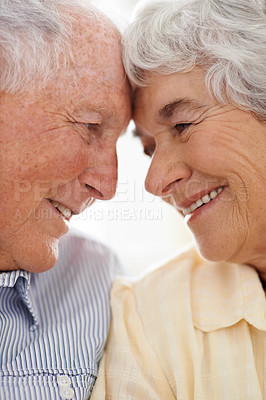 Buy stock photo Couple, senior and forehead touch for care, home and relax together for bonding and smile. Elderly people, love and affection in marriage or relationship in retirement, closeup and security in house