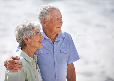 Buy stock photo Senior, couple and look happy at beach for retirement vacation or anniversary to relax with love, care and commitment with support. Elderly man, woman and together by ocean for peace on holiday.