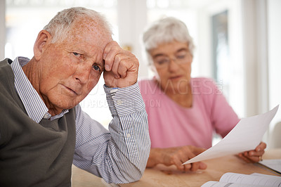 Buy stock photo Senior, couple and documents for discussion with worry, finance conversation for will at home. Elderly, stress or paper work reading with anxiety and retired people, pensioners with tax bill at table