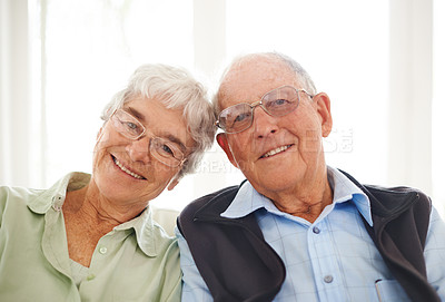Buy stock photo Old couple, portrait and smile in home in retirement for bonding connection for weekend, holiday or love. Senior Man, woman and face with glasses in apartment for marriage commitment, caring or rest