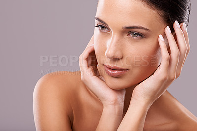 Buy stock photo Beauty shot of a beautiful young woman with perfect skin against a gray background