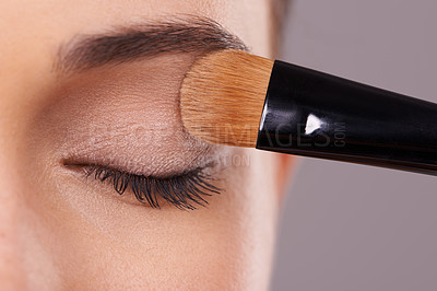 Buy stock photo Closeup, eyelash and brush for eyeshadow with woman, makeup and beauty with application on purple background. Cosmetology, transformation and cosmetic care with tools, powder product and shine