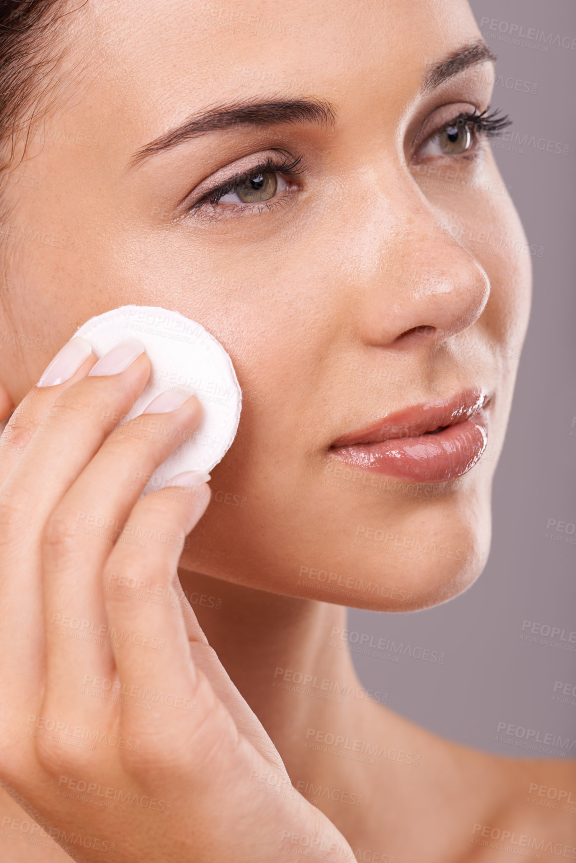 Buy stock photo Beauty, cotton pad and and woman for skincare, routine cleaning with hygiene and makeup removal isolated on grey background. Wipe, cosmetic product and dermatology for healthy skin and glow in studio
