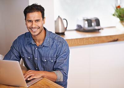 Buy stock photo Website, research and internet for man with laptop on table in kitchen for online, web and info for work. Entrepreneur or freelancer and smile with keyboard for tech, typing and email with mockup