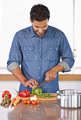 Buy stock photo Cooking, man and cutting vegetables on kitchen counter for healthy diet, nutrition or lunch. Chopping board, food and vegan person preparing salad for dinner, meal and organic ingredients in home