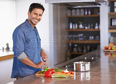 Buy stock photo Cooking, portrait and happy man chopping vegetables on kitchen counter for healthy diet, nutrition or lunch. Cutting knife, food and face of person preparing fresh salad for organic meal in home