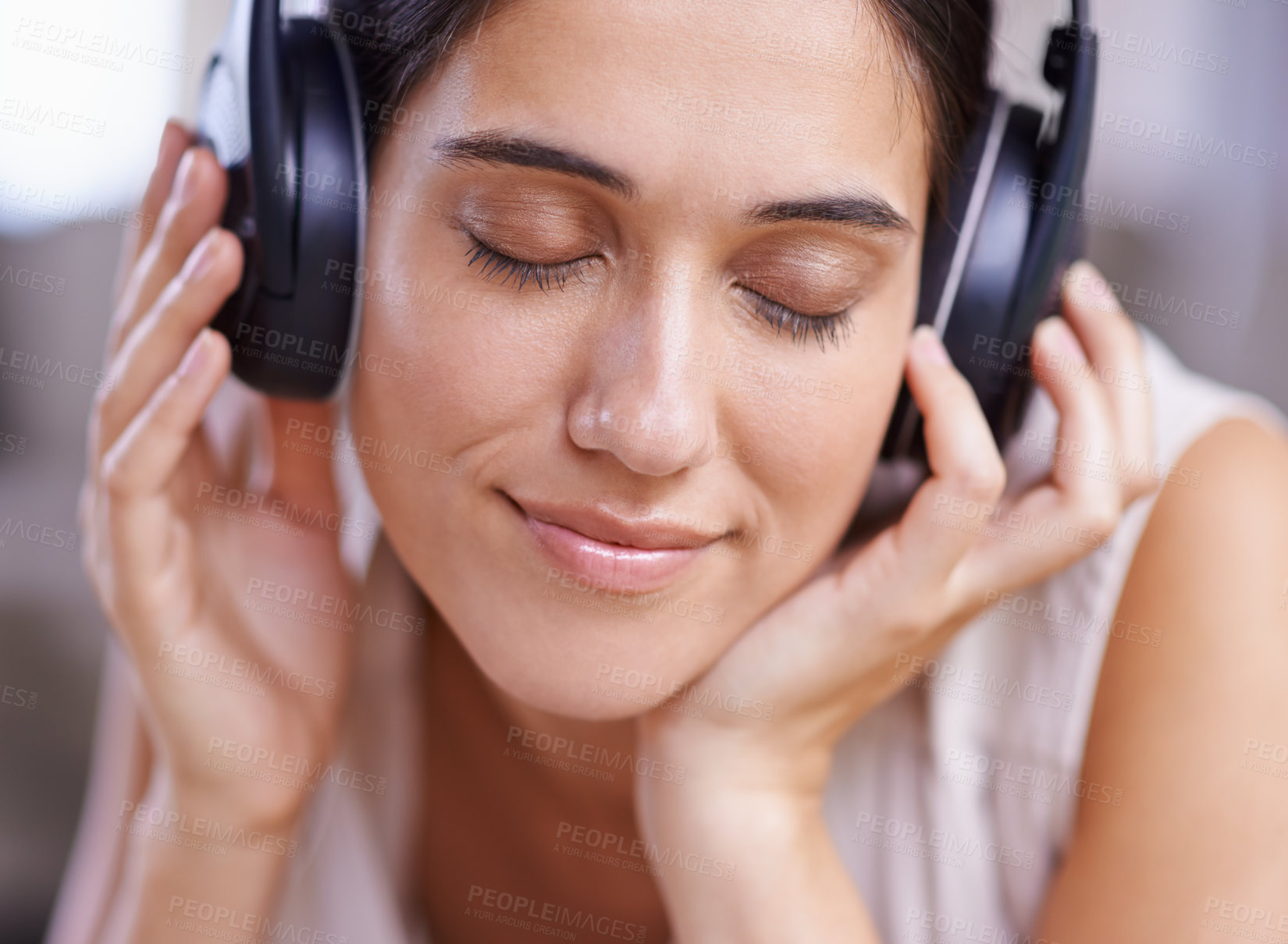 Buy stock photo Calm woman, headphones and listening to music with smile on sofa for free time, comfort or relaxing at home. Female face smiling on living room couch with headset for audio sound track or relaxation
