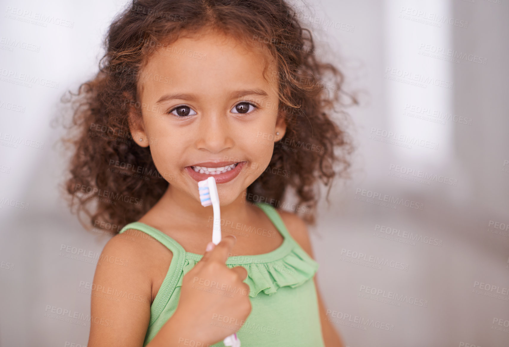 Buy stock photo Portrait of an adorable little girl holding a toothbrush