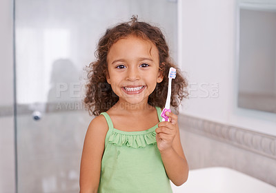 Buy stock photo Portrait, smile and girl brushing teeth in a bathroom for dental, wellness or oral care in her home. Happy, face and kid in a house with toothbrush for mouth cleaning, child development or learning