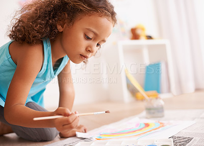 Buy stock photo Education, kindergarten or girl painting a rainbow on classroom floor for creative, learning or child development. Paper, color splash or cute kid with school art paint, sketch or having fun drawing
