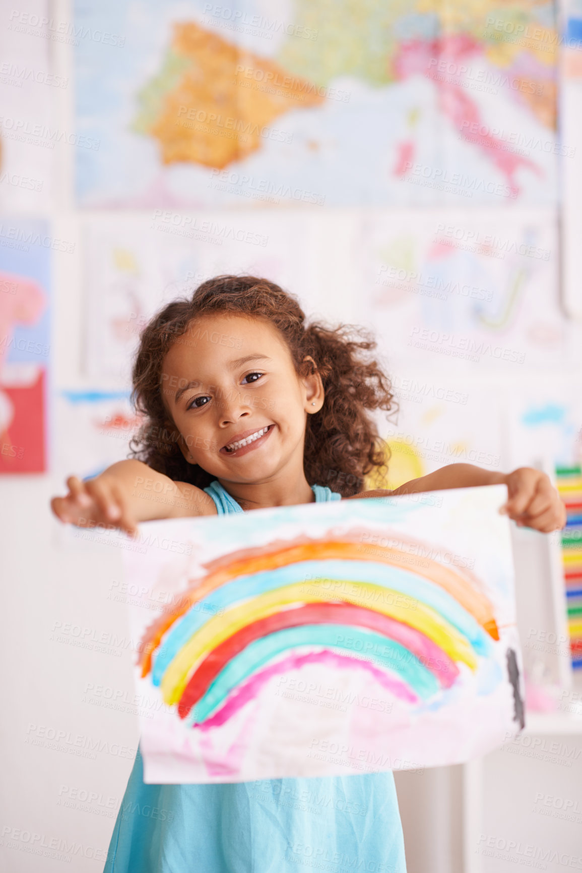 Buy stock photo Education, school and portrait of girl with rainbow painting in a classroom for creative, learning or child development. Paper, color splash and excited kid with kindergarten art, sketch or drawing