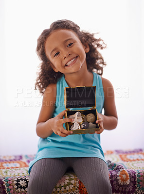 Buy stock photo Happy, portrait and girl with gift on a bed for birthday, surprise or good job, reward or present in her home. Face, smile and kid with jewellery box in bedroom for seashells, collection or hobby