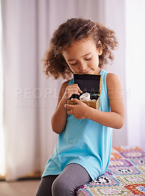 Buy stock photo Child, gift and toy in home, happy and surprise toys for girl and school reward for childhood development. Daughter, relax or smile for present in bedroom, play or curious for treasure box in house