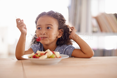 Buy stock photo Eating child, breakfast and fruit salad at home with happiness and wellness meal with a smile. House, nutrition and young girl with healthy food and fruits of a hungry kid in the morning at a table 