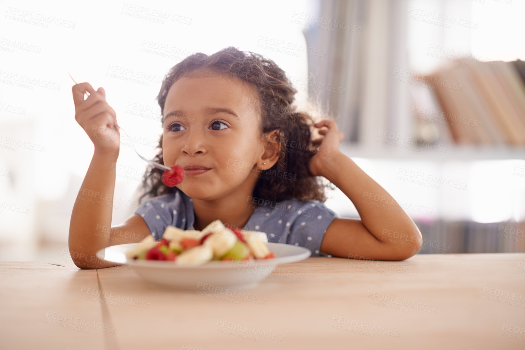 Buy stock photo Eating child, breakfast and fruit salad at home with happiness and wellness meal with a smile. House, nutrition and young girl with healthy food and fruits of a hungry kid in the morning at a table 