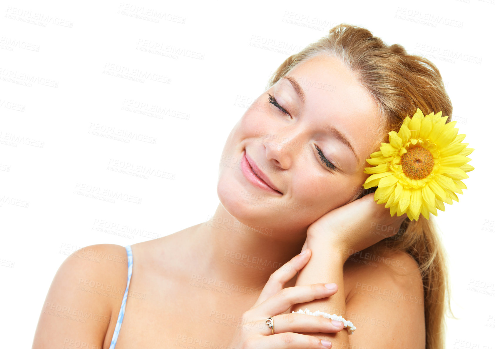 Buy stock photo Skincare, smile and happy woman in studio with sunflower in her hair for natural cosmetics on white background, Flower, face or female model with wellness, glowing skin or organic beauty treatment