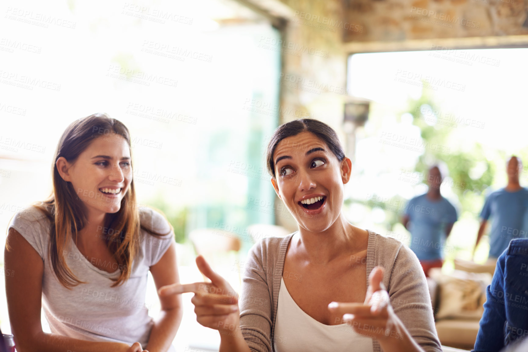 Buy stock photo Smile, funny face and conversation with friends in restaurant together for social gathering or bonding. Happy, facial expression and hand gesture with woman talking to group of people in coffee shop