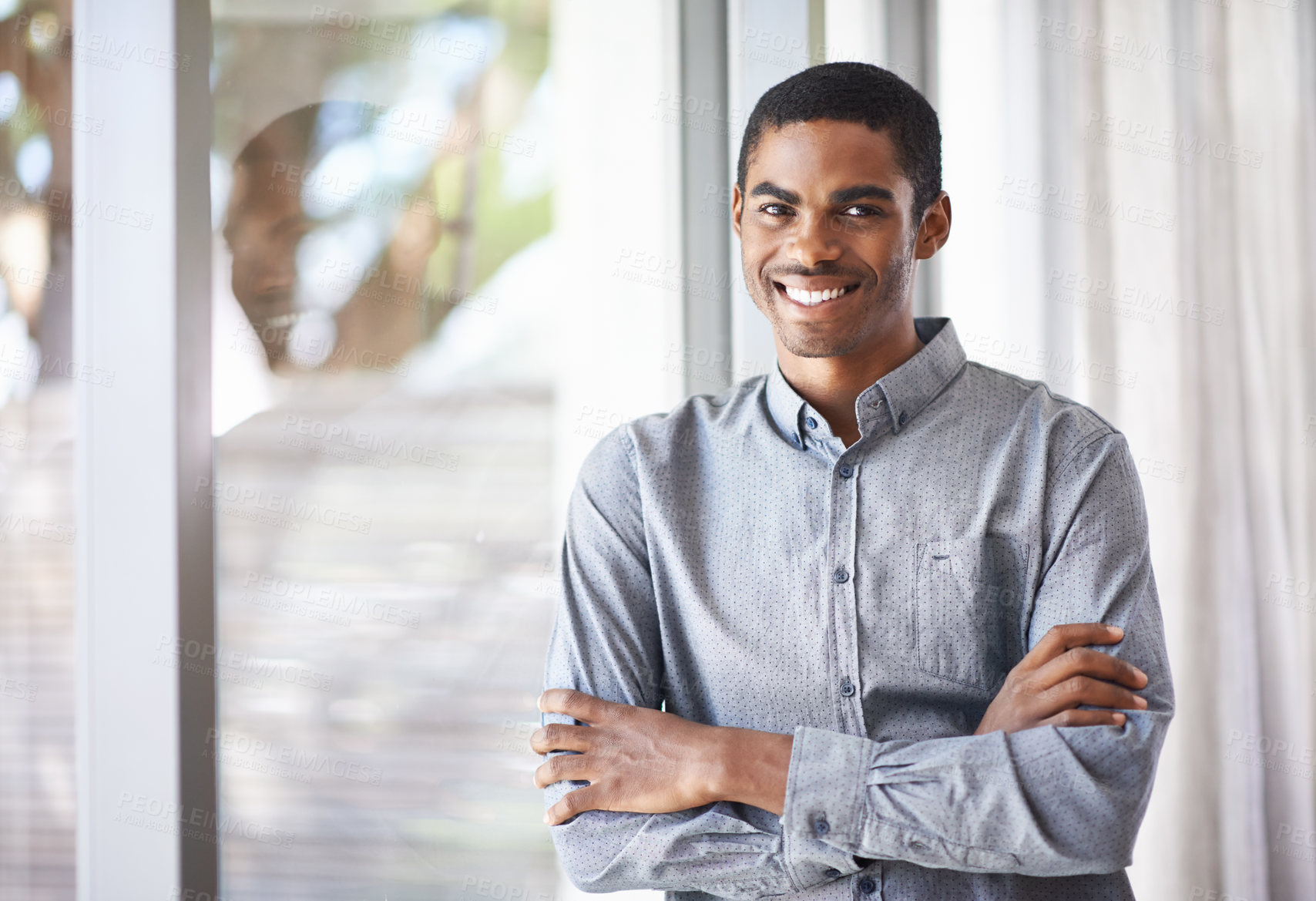 Buy stock photo Happy black man, portrait and window with arms crossed for career ambition, job or creative startup at office. African male person or employee smile in confidence for expertise or positive mindset