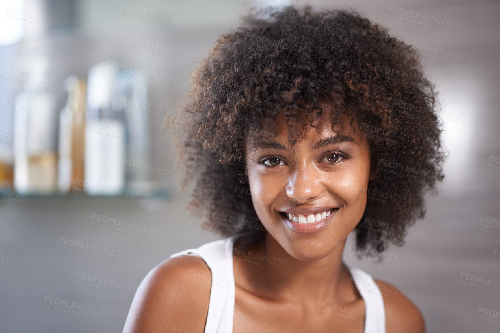 Buy stock photo African woman, portrait and smile in bathroom for beauty, wellness and afro in home to start morning routine. Girl, person and happy with cosmetics, change and transformation with hair in apartment