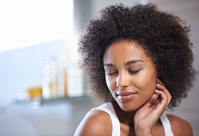 Buy stock photo Cropped shot of an attractive young woman with her eyes closed