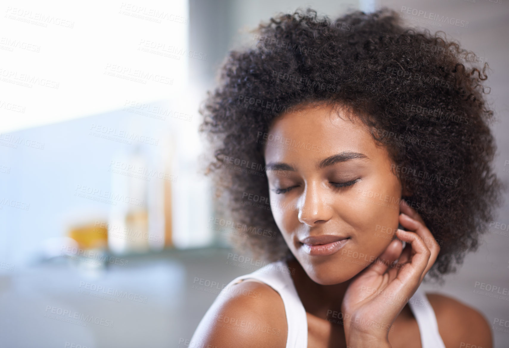 Buy stock photo Cropped shot of an attractive young woman with her eyes closed