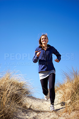 Buy stock photo Fitness, woman running in nature for training and smiling for motivation. Healthy sports workout, freedom and female athlete or runner excercise for marathon practice in dirt or grassy trail