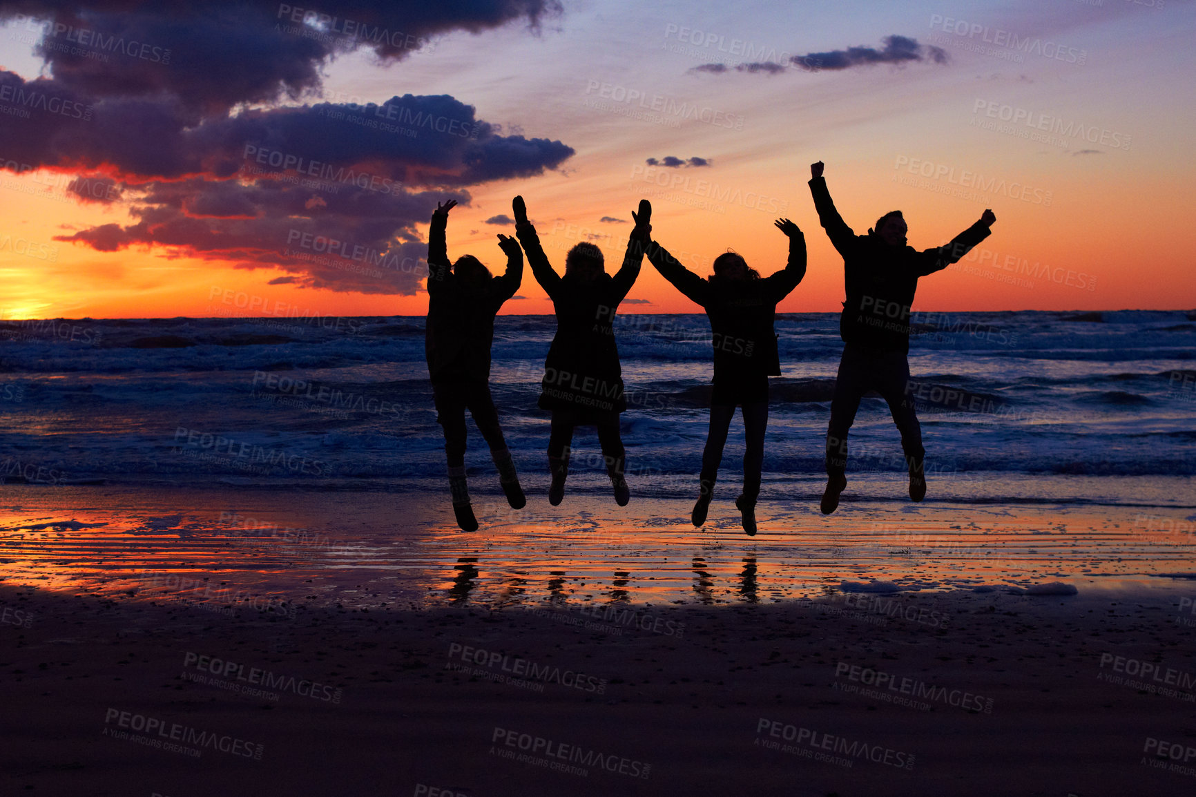 Buy stock photo Sunset, beach and silhouette of jumping friends in nature, freedom and celebrating travel outdoor. Shadow, jump and group of people at the ocean at sunrise for adventure, celebration or sea vacation