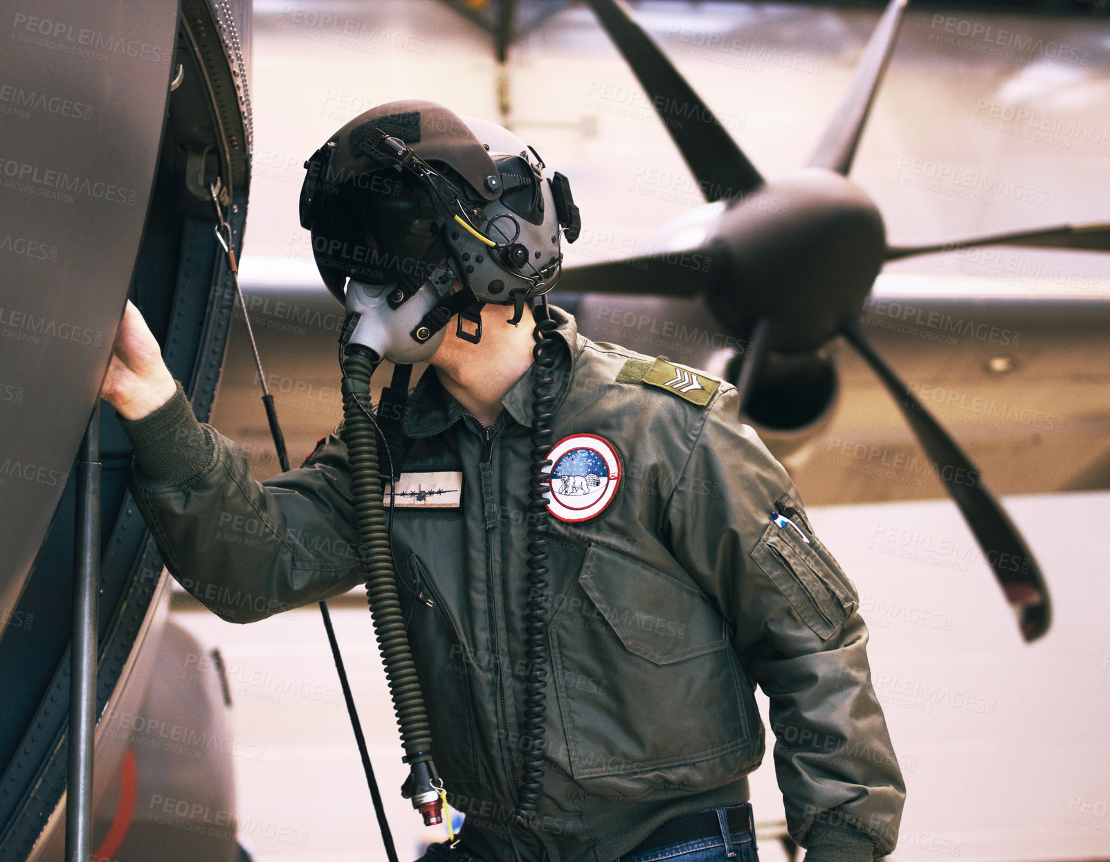Buy stock photo Shot of a fighter pilot inspecting his aircraft