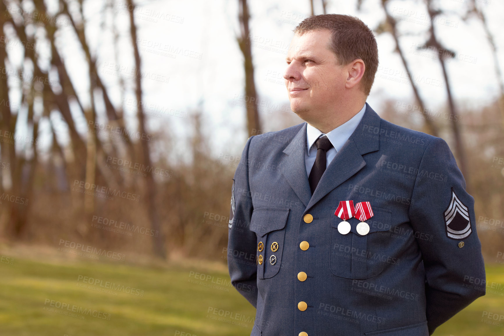 Buy stock photo Shot of a high ranking military officer standing at ease in the outdoors
