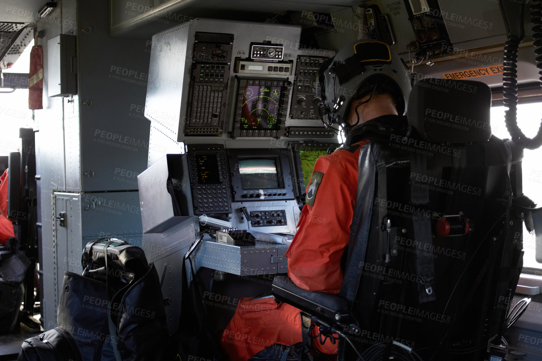 Buy stock photo Young male pilot concentrating in his cockpit as he flies his plane