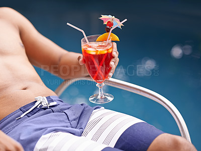Buy stock photo Man, relax and drink at swimming pool with cocktail at hotel, resort and travel on luxury vacation. Summer, holiday and glass of alcohol in hand on deck at poolside in Miami with hospitality closeup