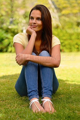 Buy stock photo Happy, smile and woman on the grass at a park for thinking, peace and relax in nature during summer. Vision, freedom and young girl with an idea while on a field or lawn with bokeh background