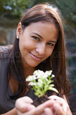 Buy stock photo Woman, flower and gardening with portrait in nature, ecology and sustainability with environment. Landscaping, gardener with plant and eco friendly for growth, green and botanical with smile outdoor