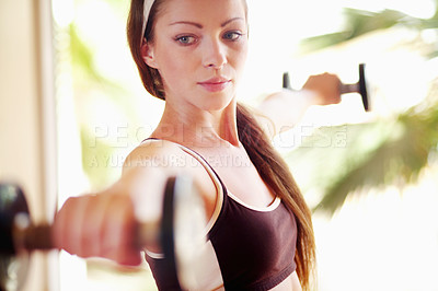 Buy stock photo Fitness, workout and woman with dumbbells for exercise, training or sports. Athlete, bodybuilder and female person weight lifting for strong muscle, serious power or health, wellness or energy in gym