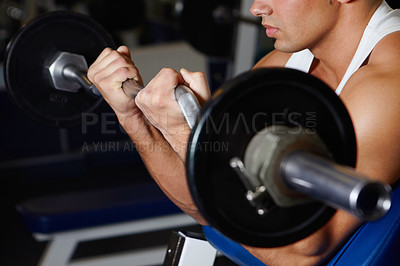 Buy stock photo Bench curling hands, barbell and man with iron, metal or steel gym equipment for muscle strength, power building or development. Weightlifting, determined focus and male athlete doing fitness circuit