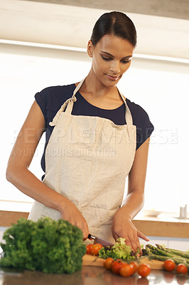 Buy stock photo Cropped shot of a beautiful woman standing in her kitchen a home