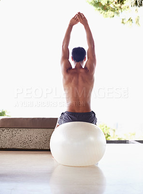 Buy stock photo Man, back view with ball and exercise, stretching for pilates and flexibility with health and self care at home. Fitness, training and strong athlete with equipment for workout, balance and yoga