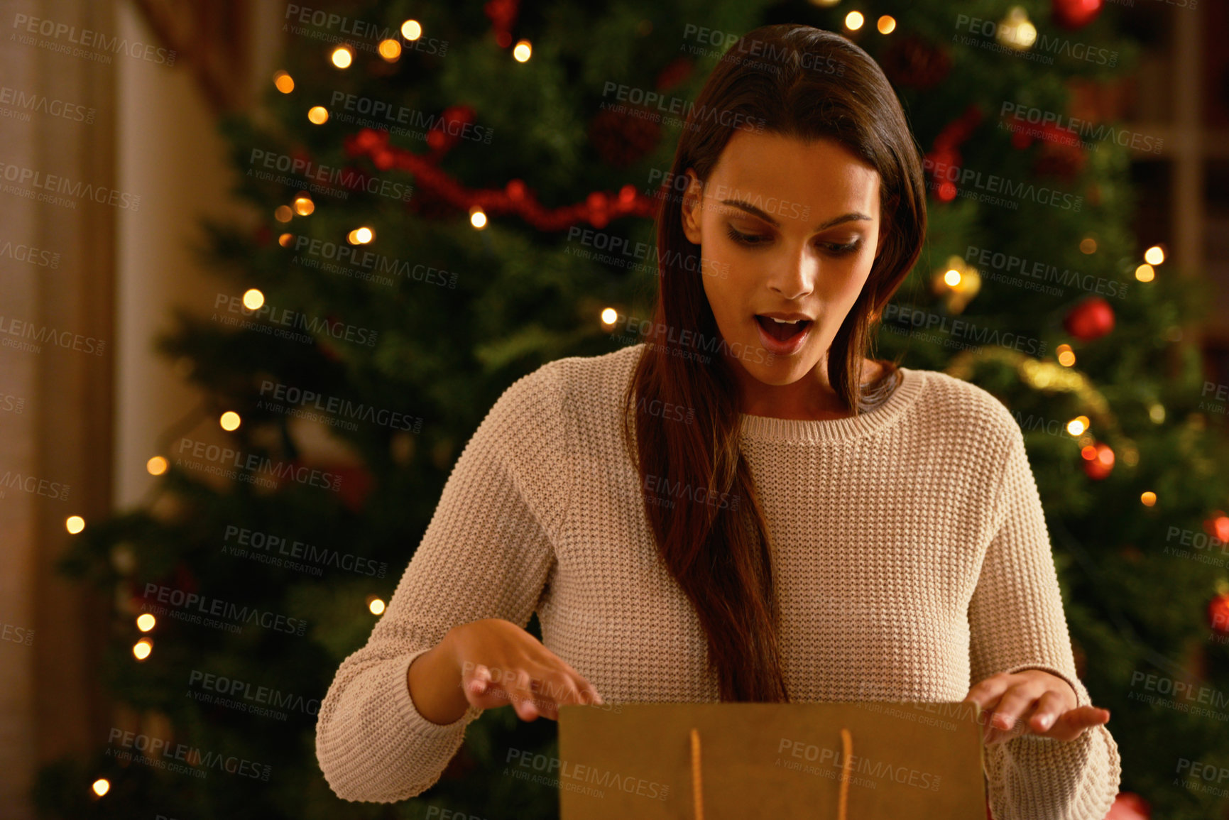 Buy stock photo Happy woman, christmas tree or surprise for opening gifts of santa wishlist or holiday celebration in living room. Young lady, excited and present for xmas and symbol of love on vacation, wow and bag