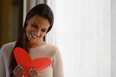 Buy stock photo Heart, love and woman reading card for valentines celebration, mothers day or celebrate special day. Happy, smile and young excited person read red note or romantic holiday cards for romance in home