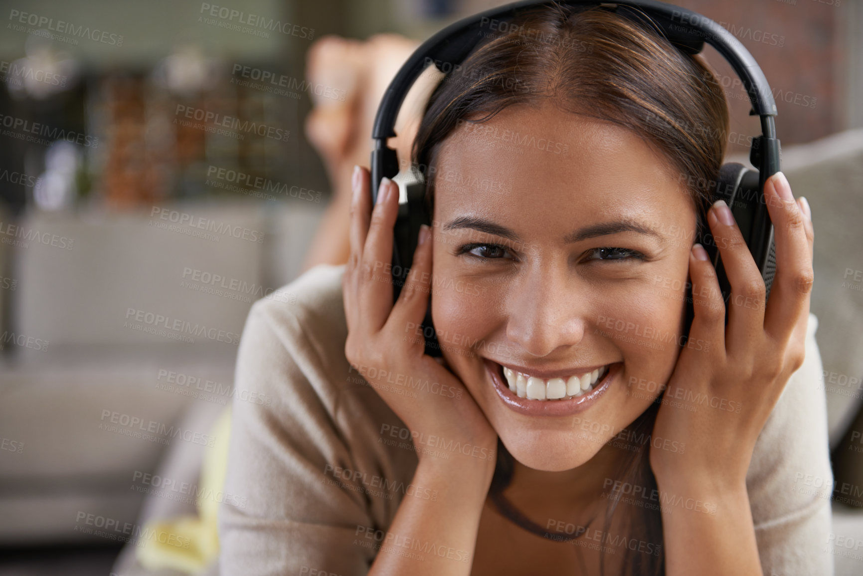 Buy stock photo Music, listening and portrait of happy woman on sofa in home streaming radio, playlist or podcast. Girl, smile and hearing sound from headphones on couch with free audio or relax with rock song
