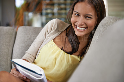 Buy stock photo Happy, portrait and woman reading book on couch and relax on holiday or vacation in home with fantasy novel. Calm, break and learning about history or philosophy on comfortable sofa in apartment